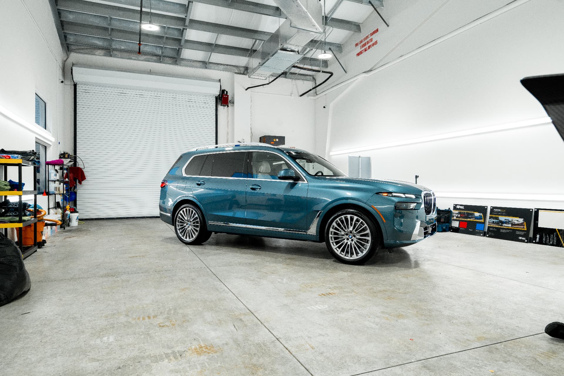 Blue BMW X7 in the Fort Myers shop after full paint protection and ceramic coating