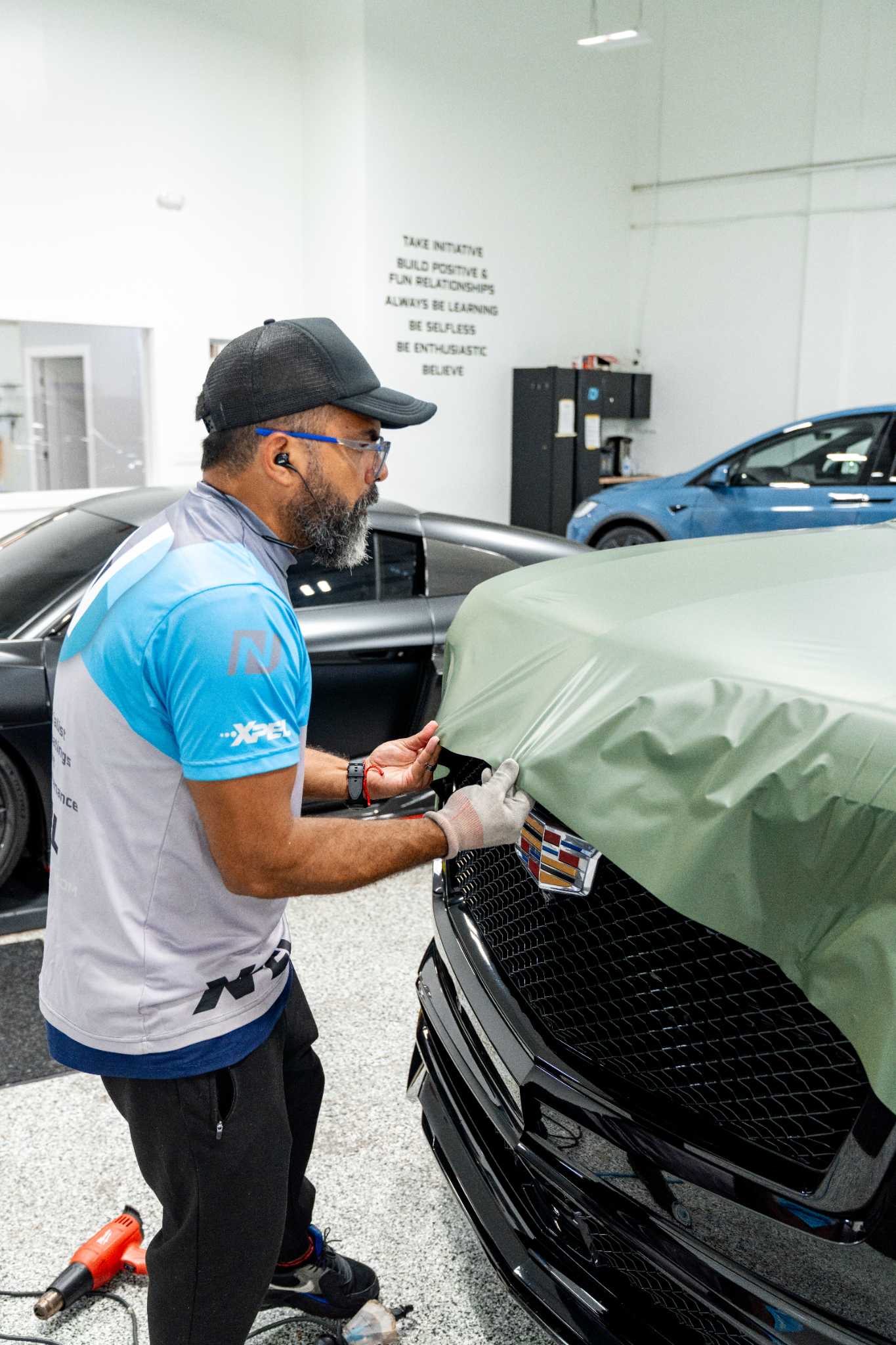 Technician detailing a vehicle inside the Fort Myers shop