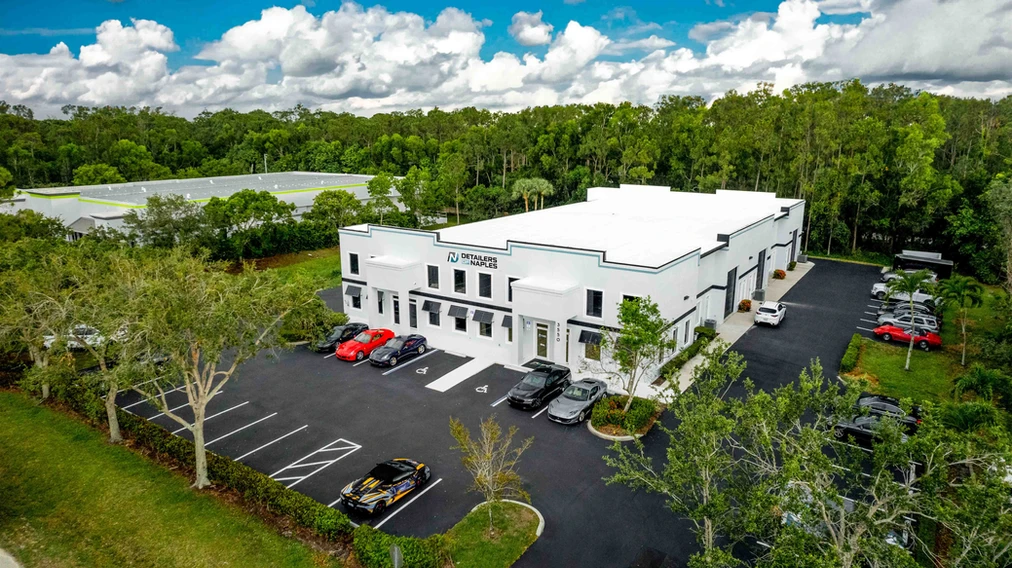 Aerial view of the Detailers of Fort Myers facility with cars parked outside